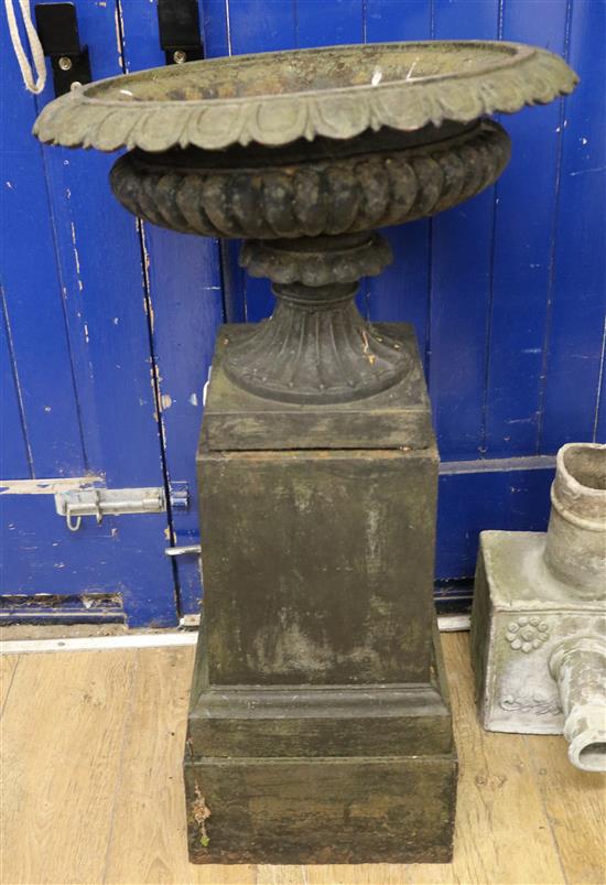 A cast iron urn on stand, H.95cm